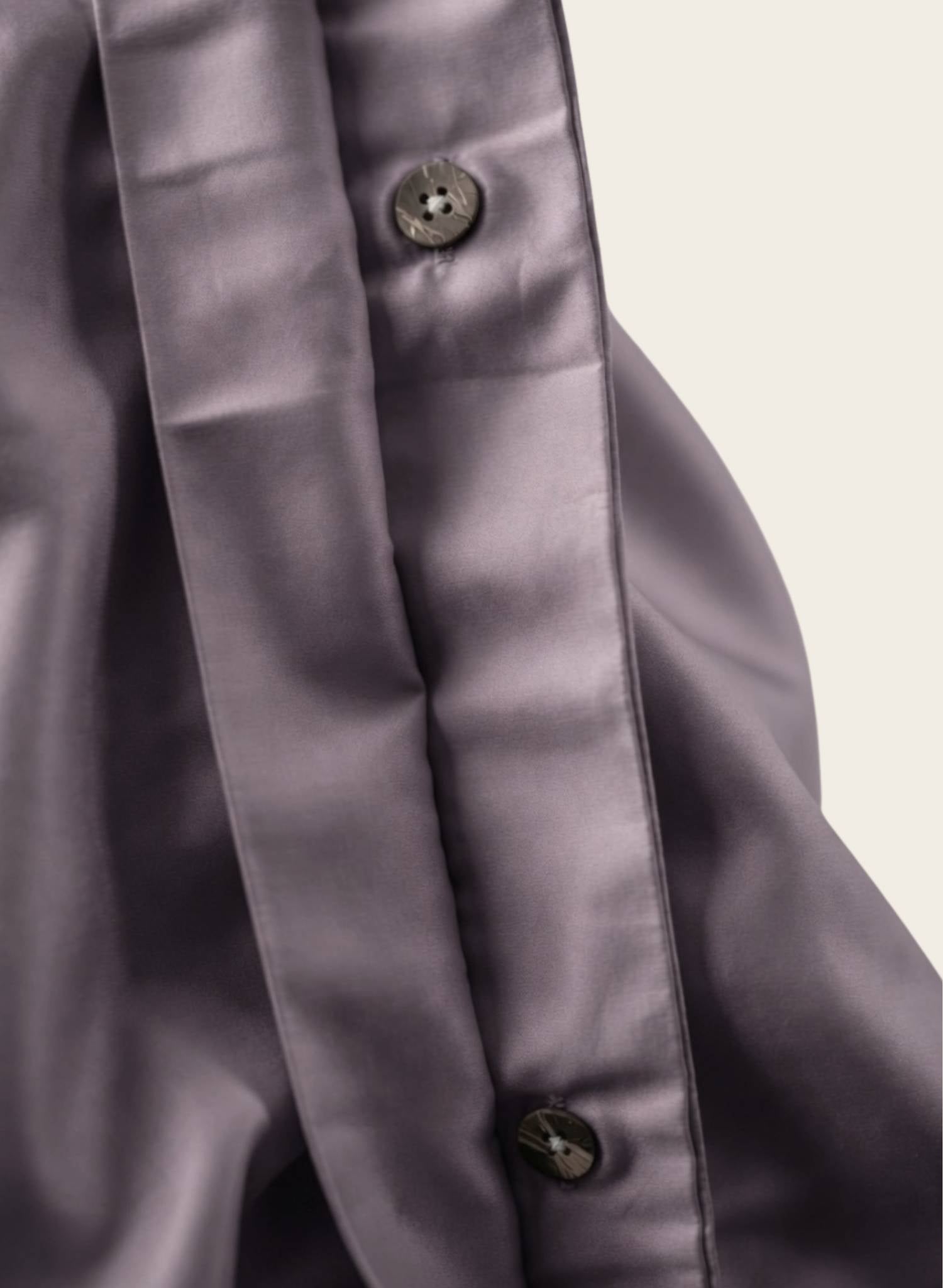 Close up of button hole for plum duvet cover