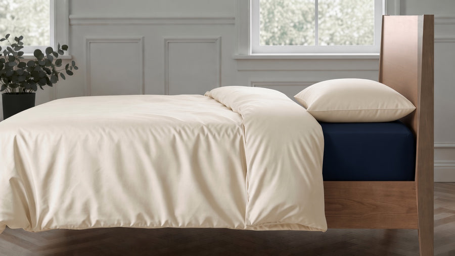 Clotted Cream duvet cover and pillowcase with Navy 2026 sheets