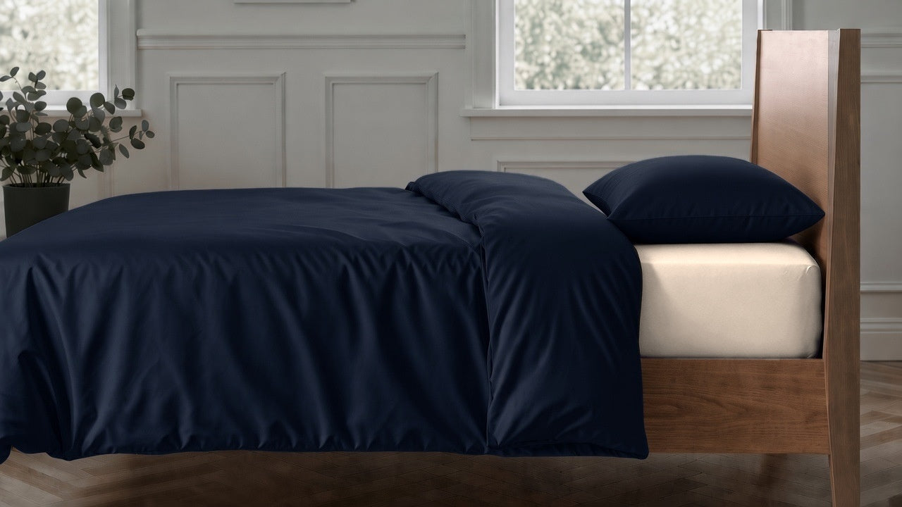 Navy 2026 duvet cover and pillowcase with Clotted Cream sheets