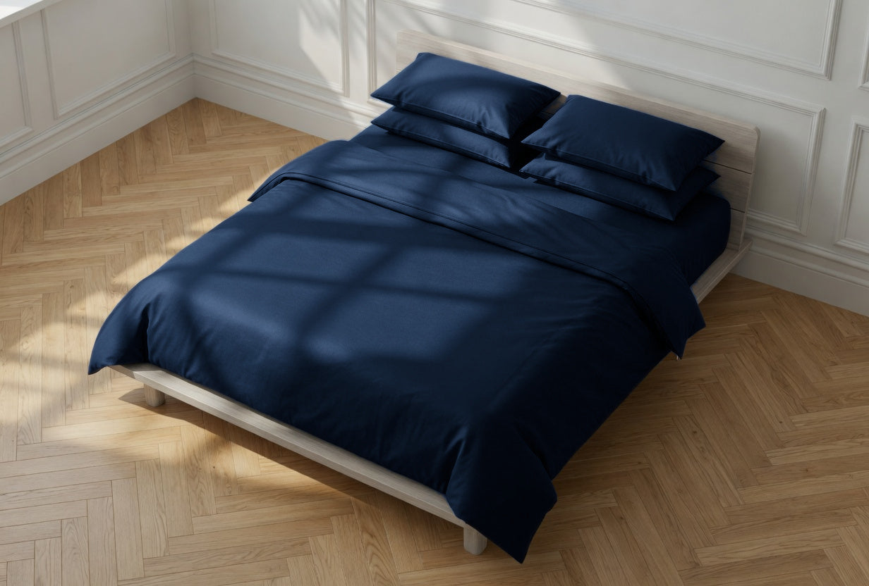 House of March Ink Blue organic cotton an overhead angled view of a bed with ink blue duvet cover