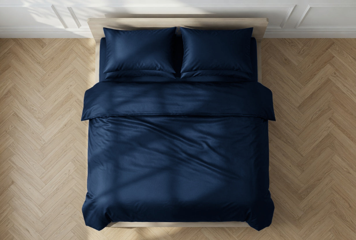 House of March Ink Blue organic cotton an overhead view of a bed with ink blue duvet cover