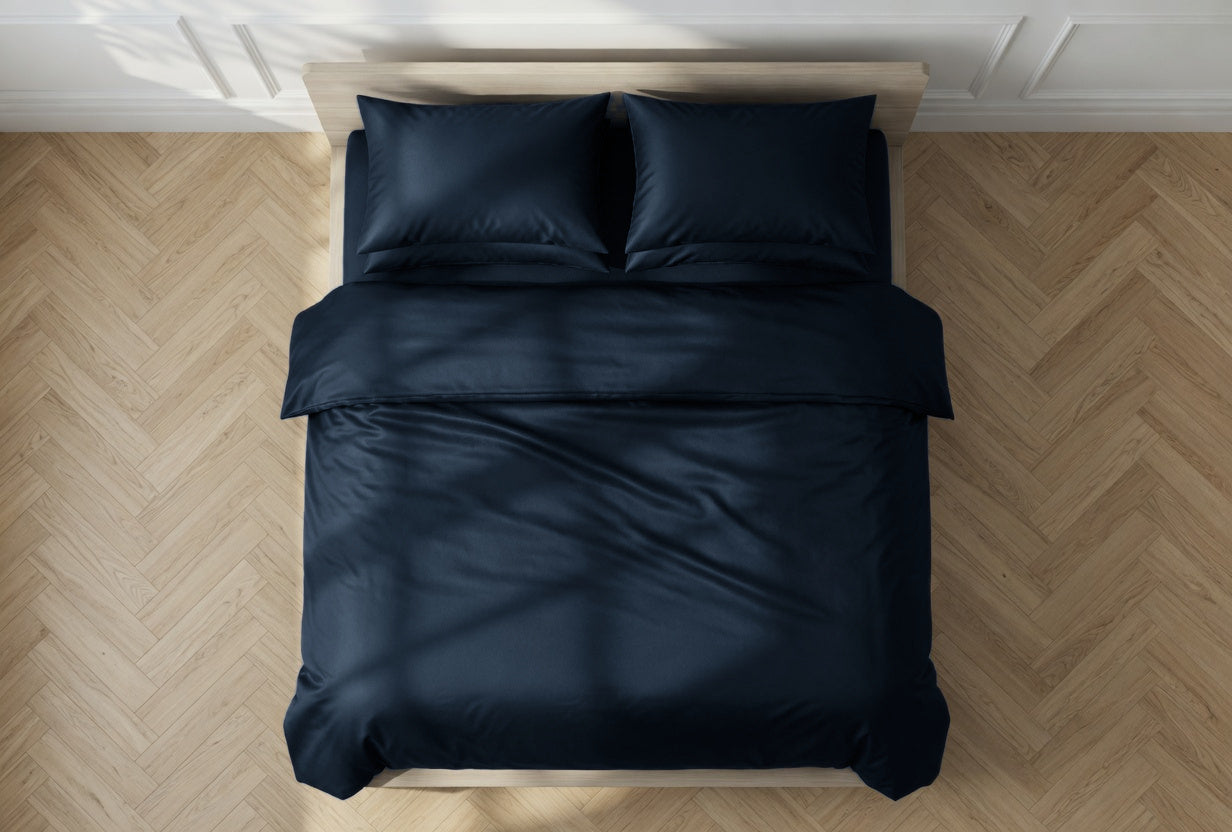 House of March Navy 2026 organic cotton duvet cover on a bed seen from overhead