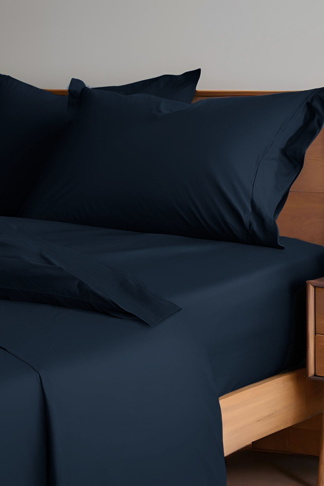 House of March Navy 2026 organic cotton sheets and pillowcases on a bed